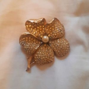 Floral brooch with pearl in center